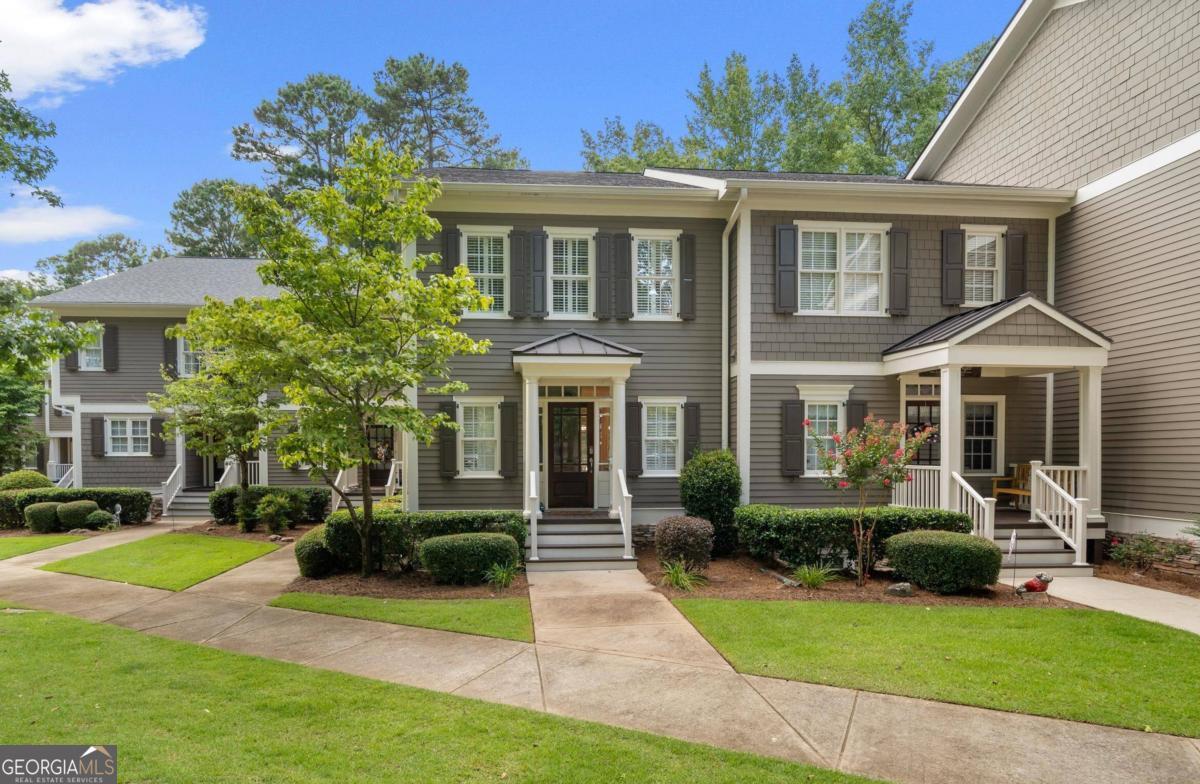 a front view of a house with garden