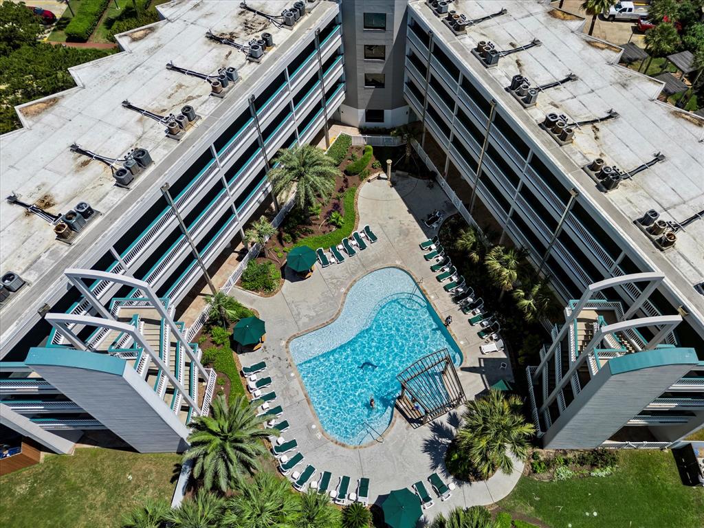 an aerial view of a residential houses with outdoor space