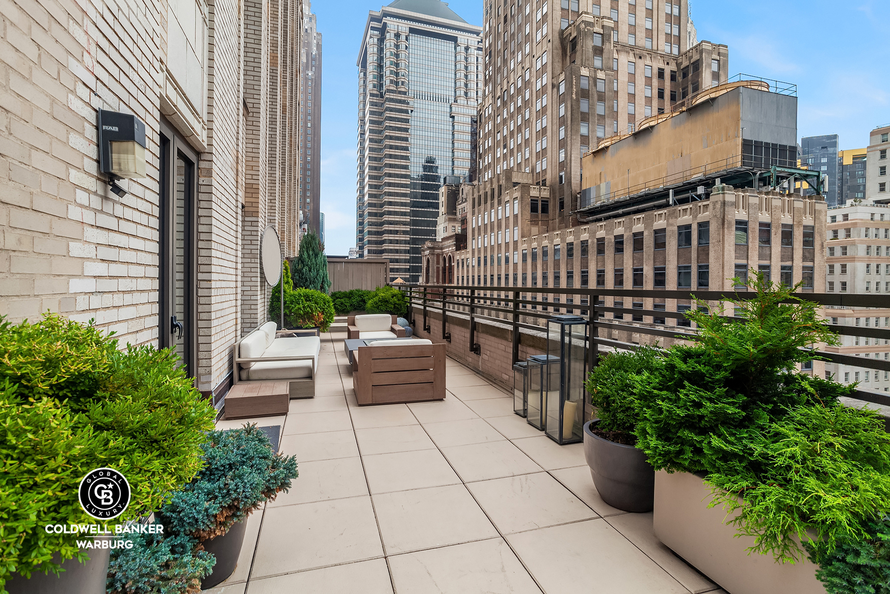 a view of a patio with couches table and chairs and potted plants