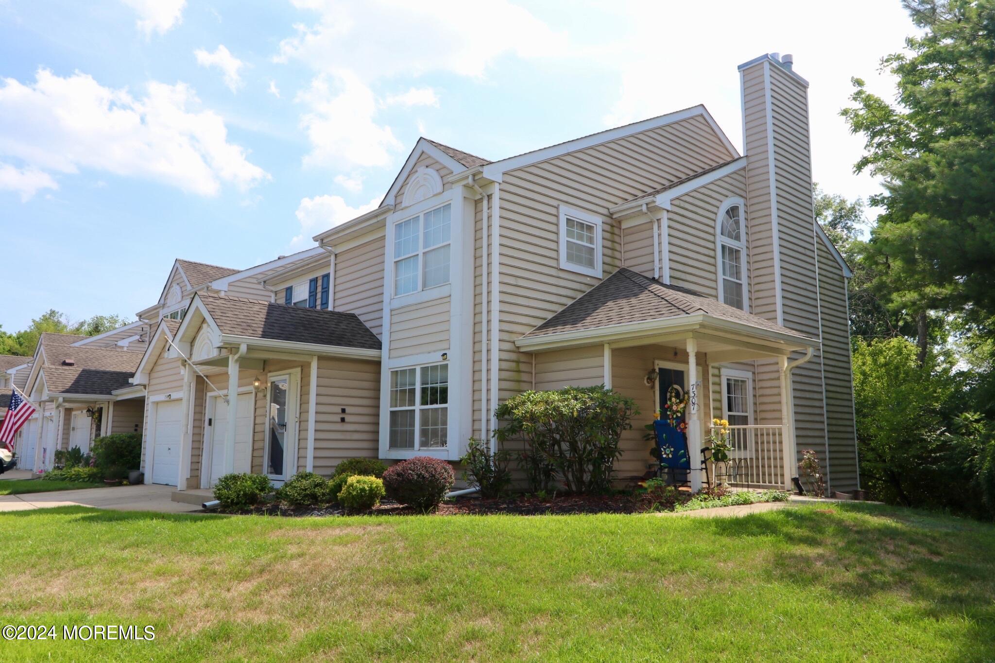 front view of a house with a yard