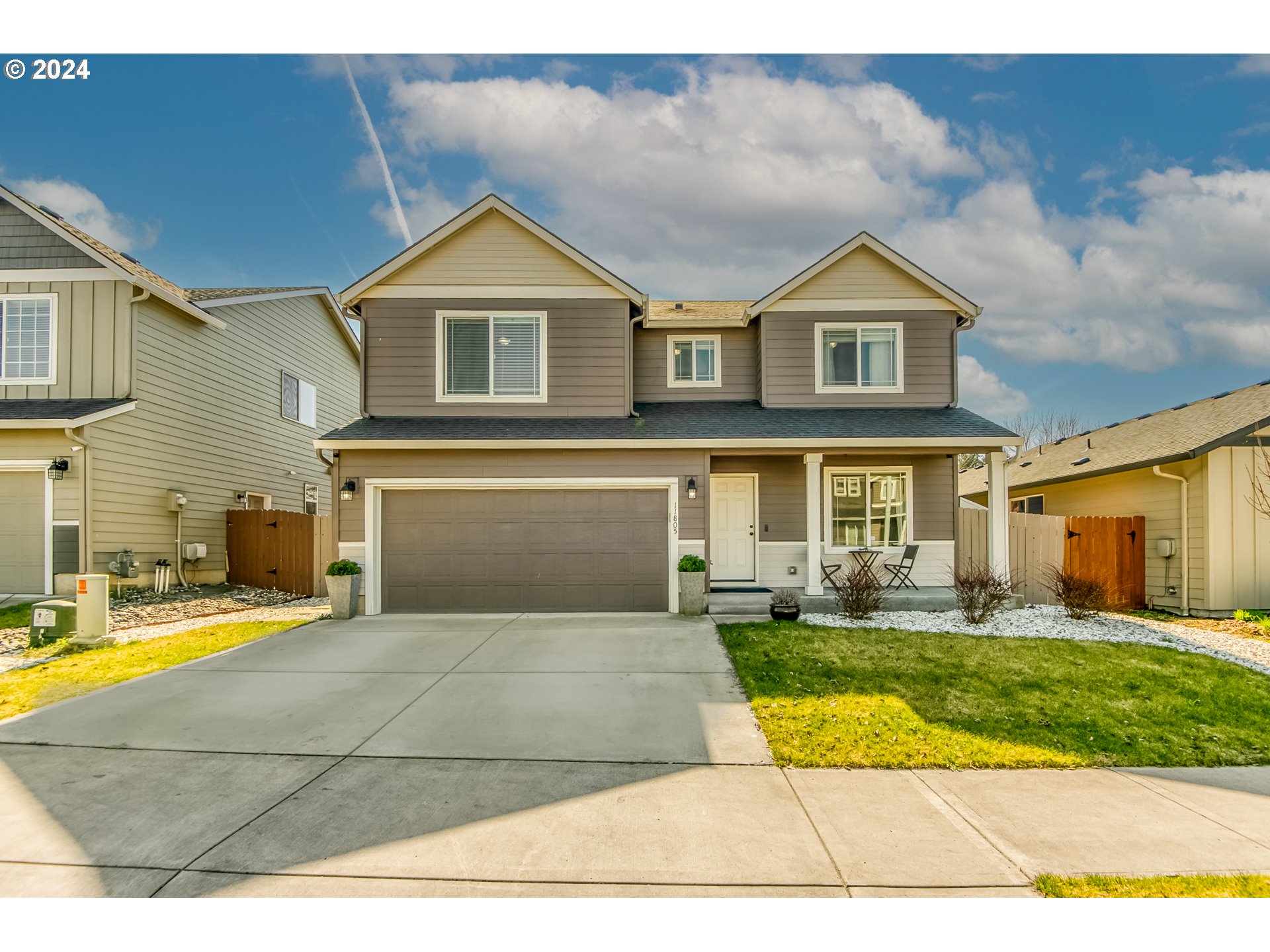 a view of house with yard and entertaining space