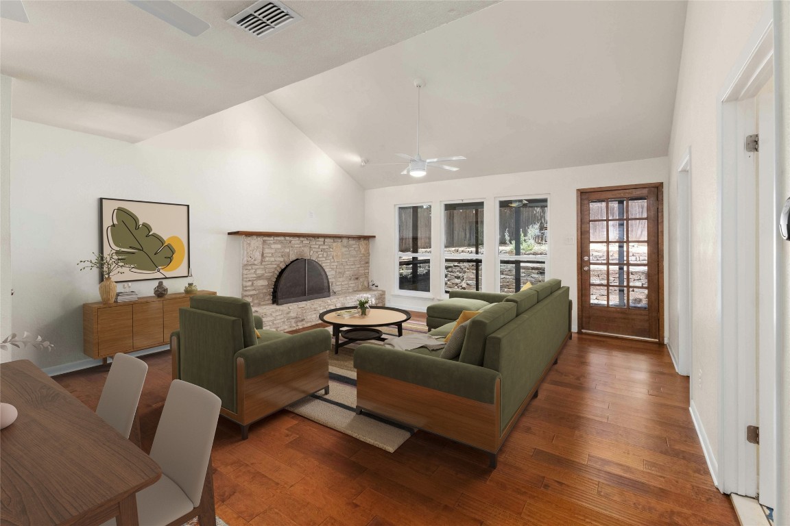 a living room with furniture and a fireplace