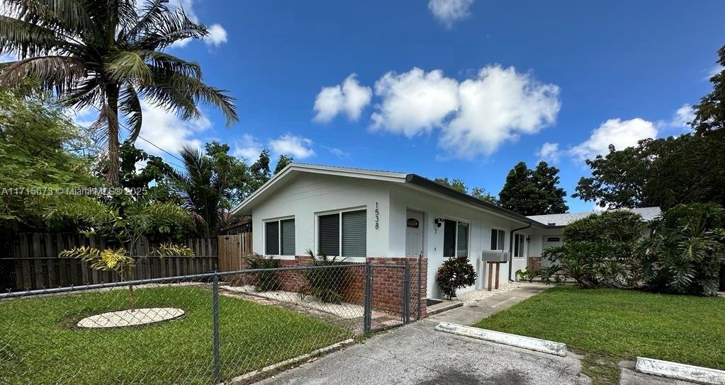 a view of house with yard