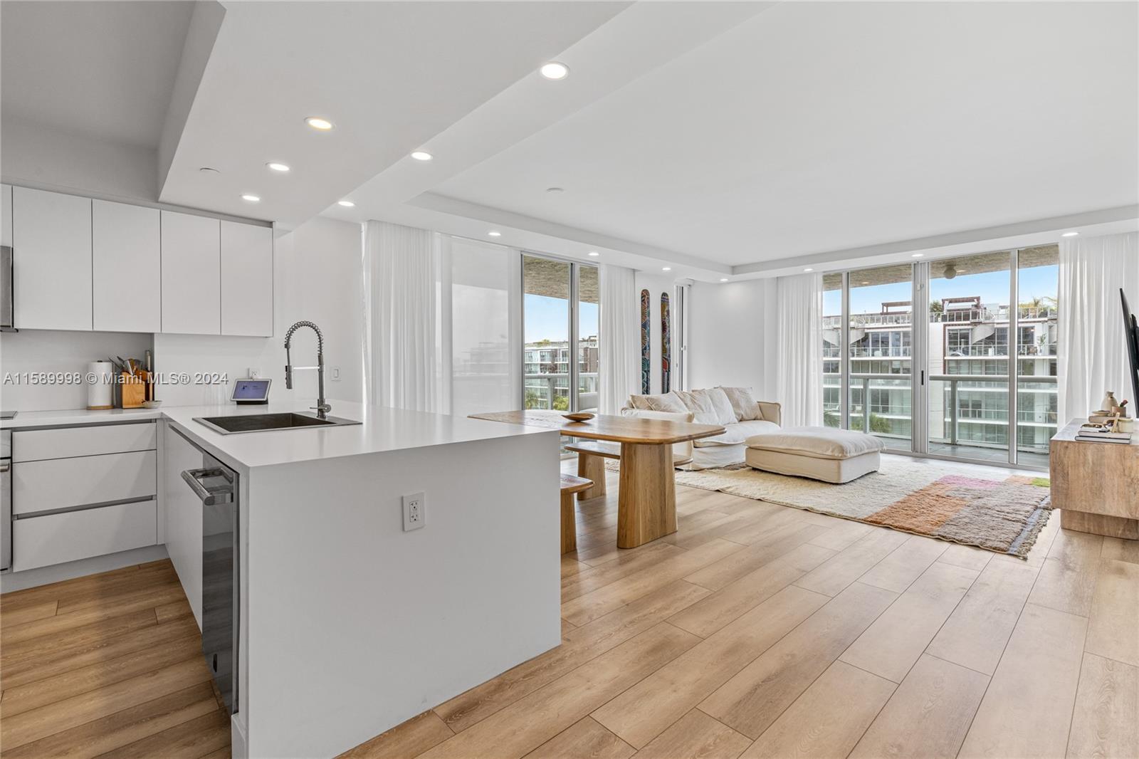 a kitchen with a sink stove and wooden cabinets