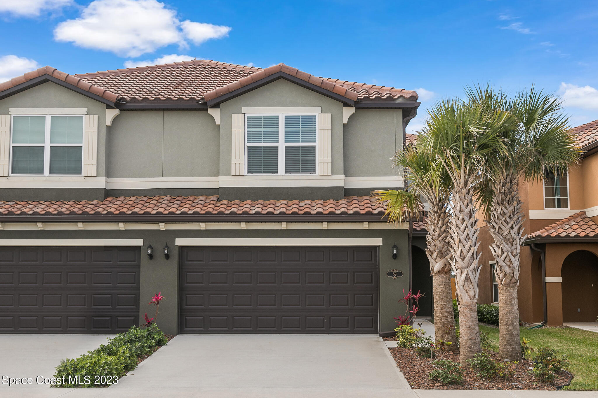 a front view of a house with a garage