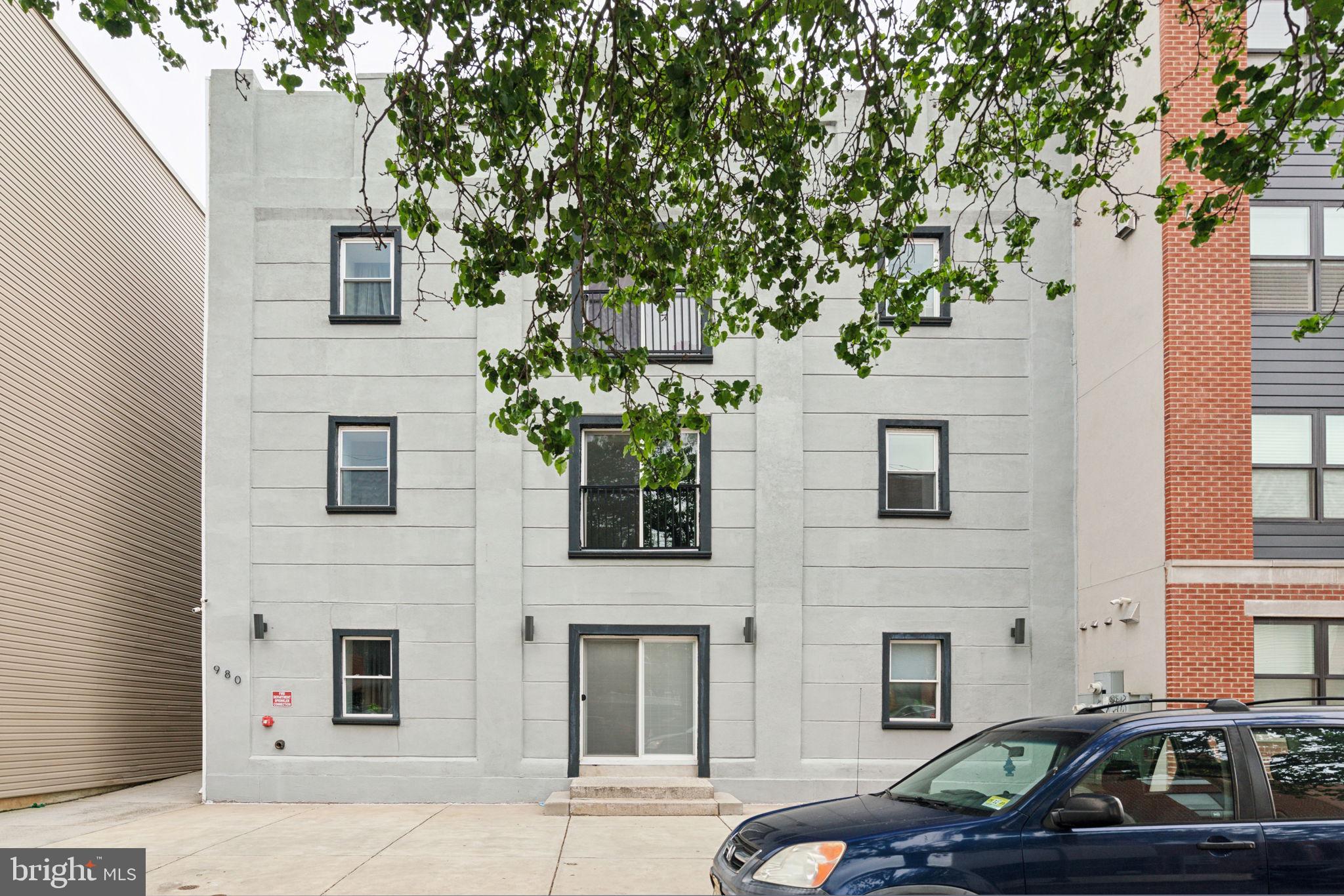 a front view of a house with parking