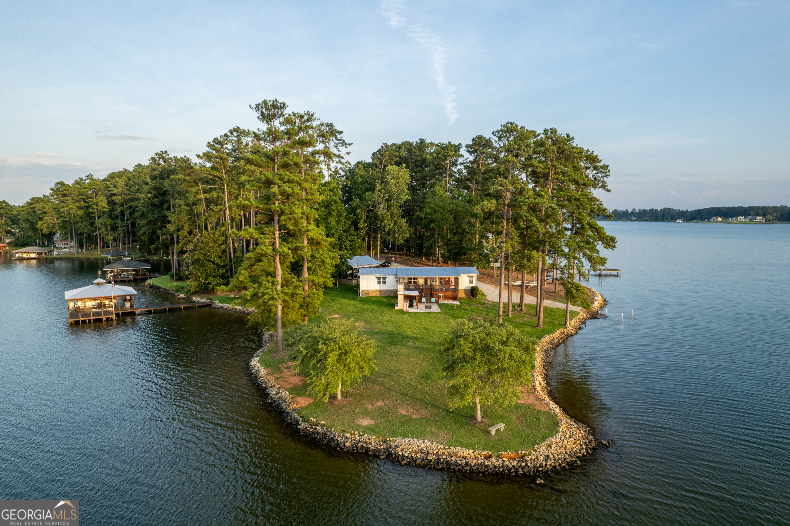 a view of a lake with a yard