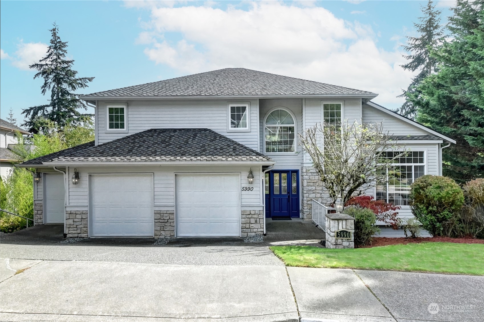 a front view of house with garage