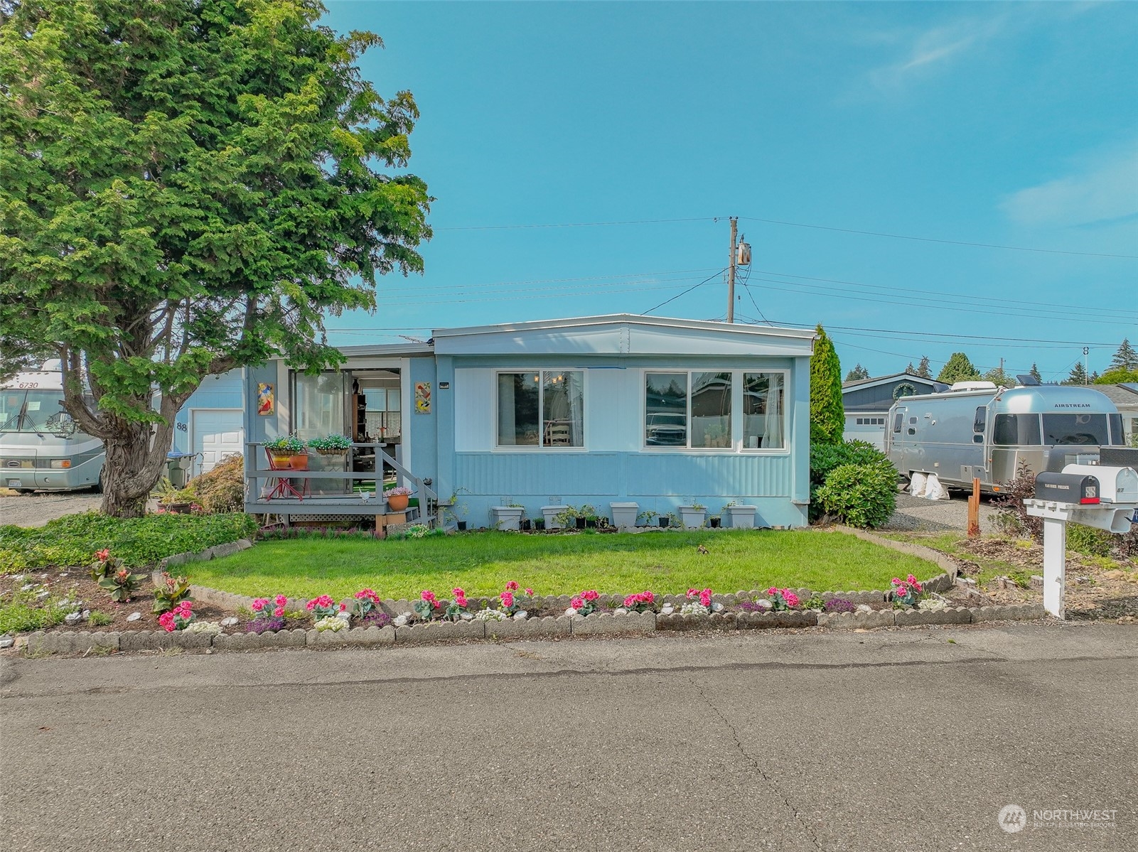 a front view of house with yard and green space