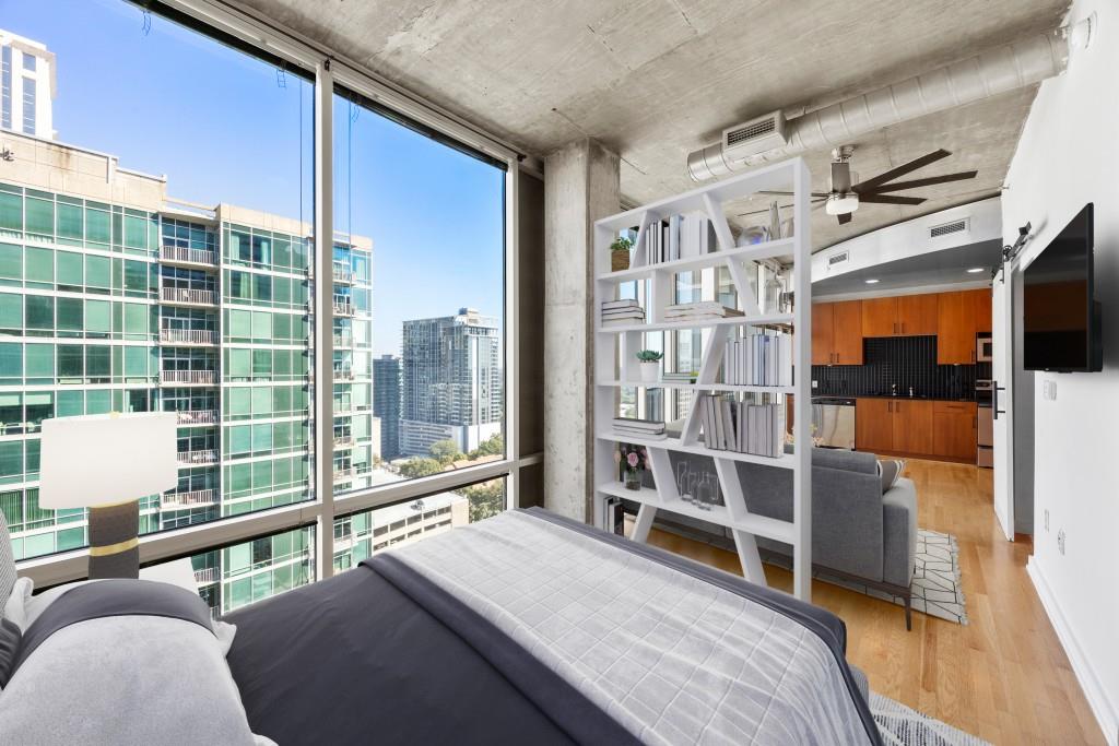 a bedroom with furniture and a window