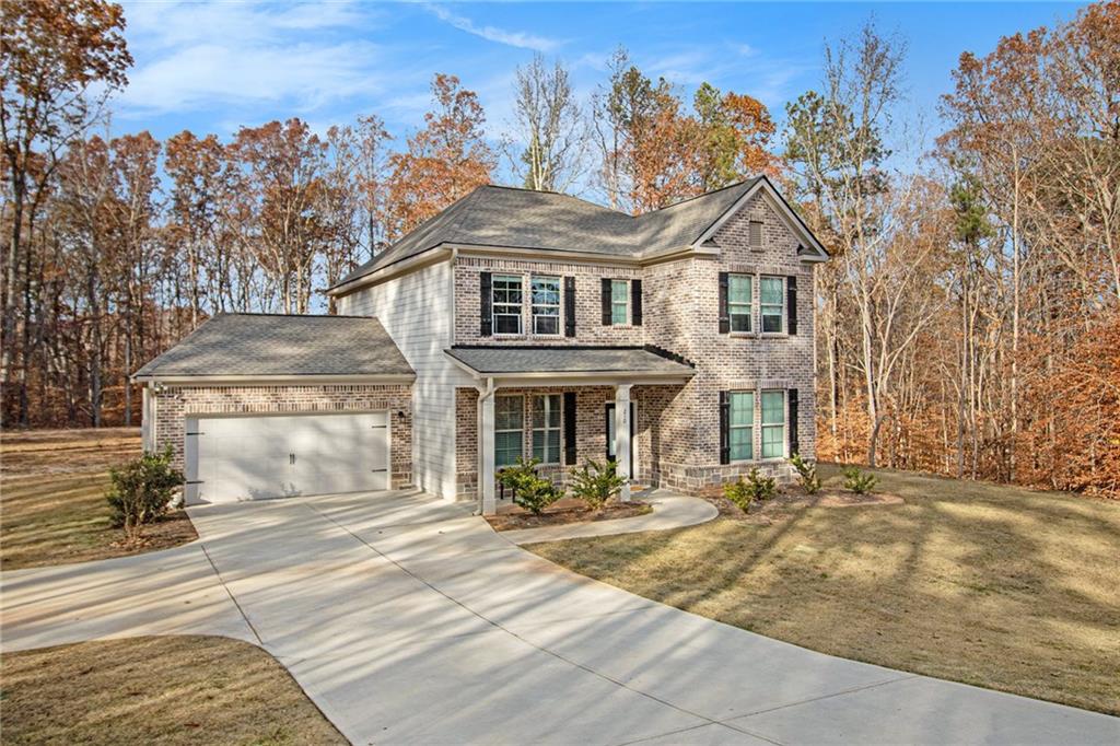 front view of a house with a yard