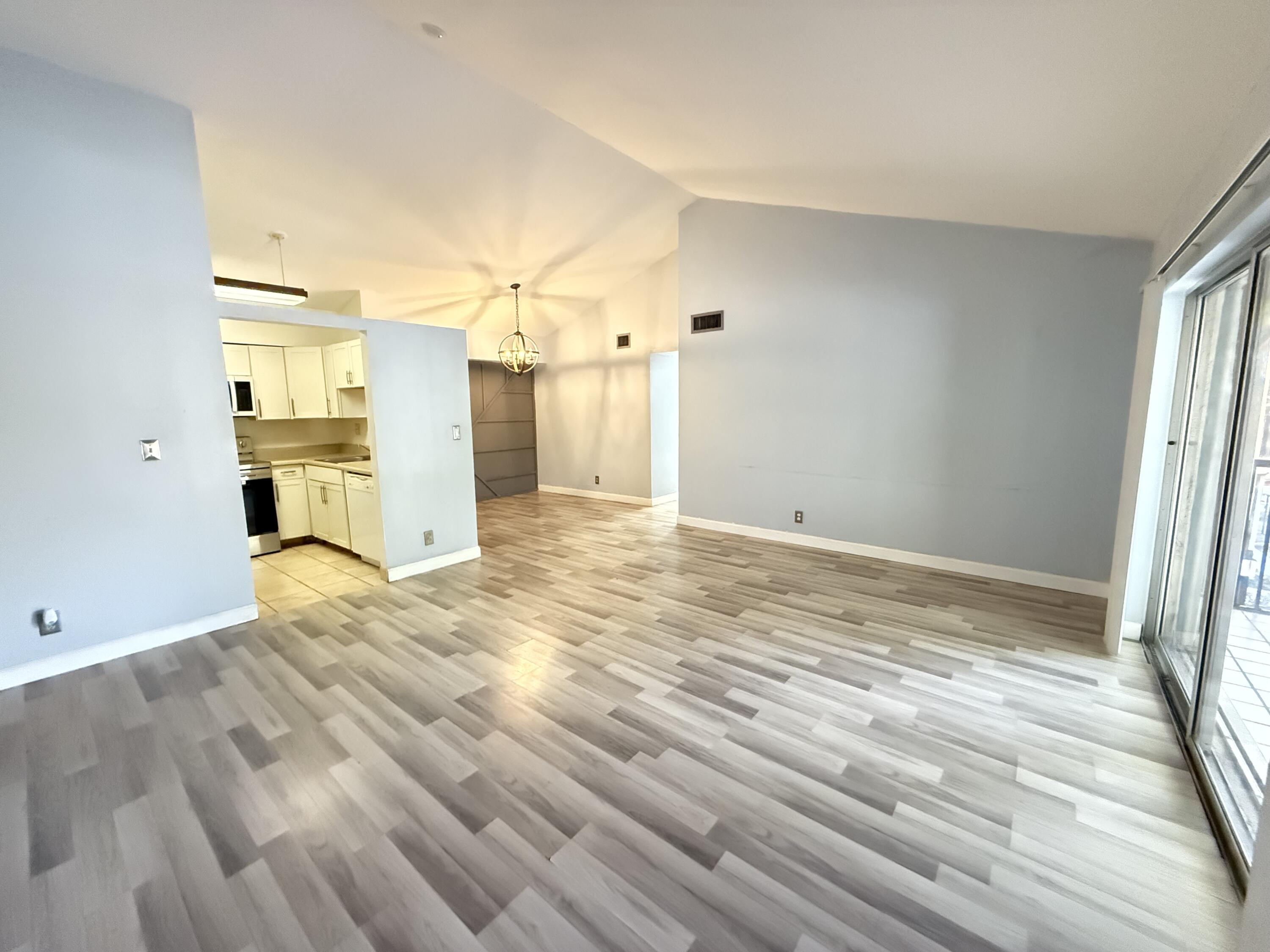 a view of a bedroom with a sink and natural light