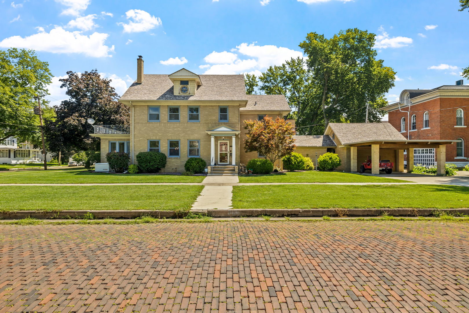 a front view of a house with a yard