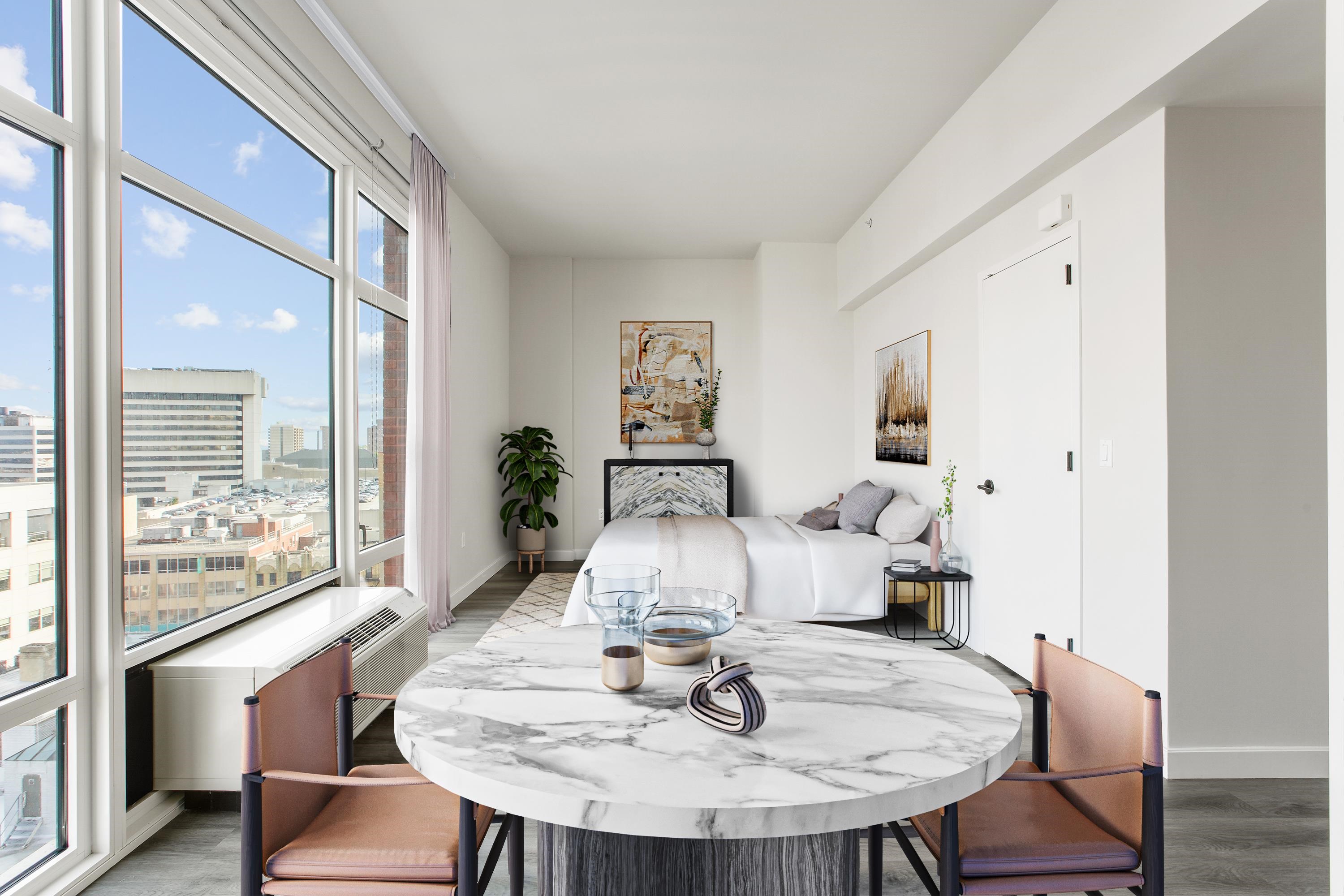 a living room with furniture and a table