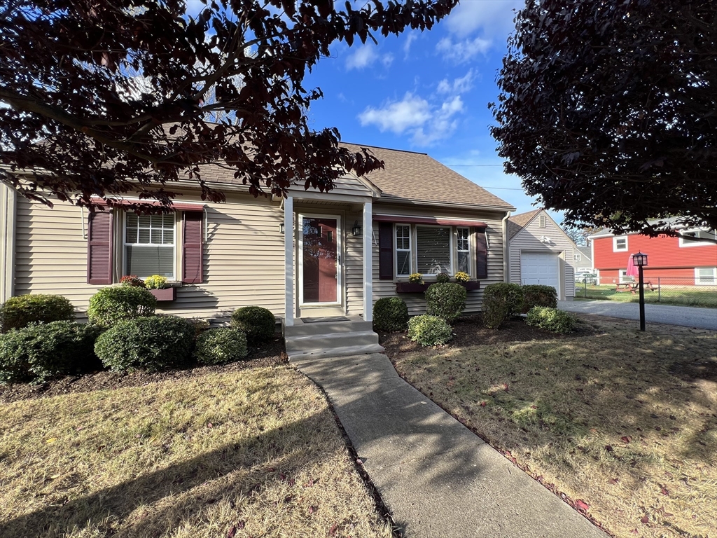 a front view of a house with a yard