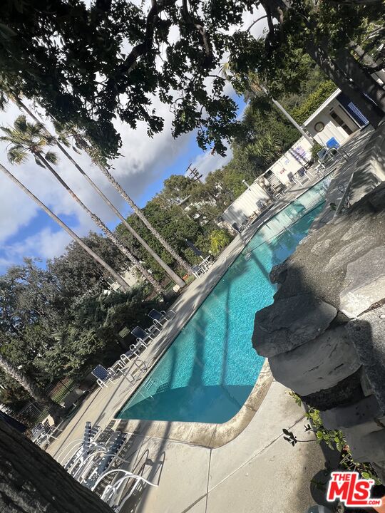 a view of swimming pool from a balcony