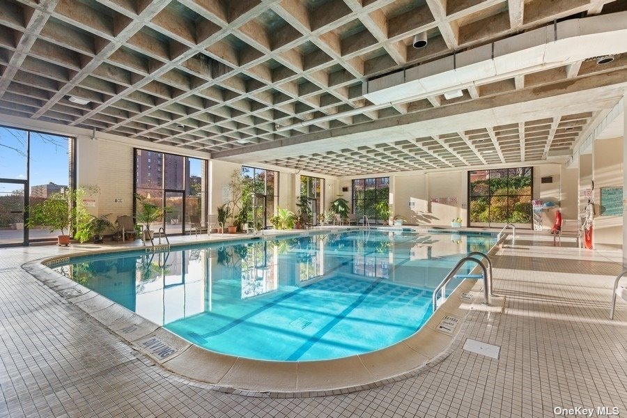 a view of a swimming pool with a patio