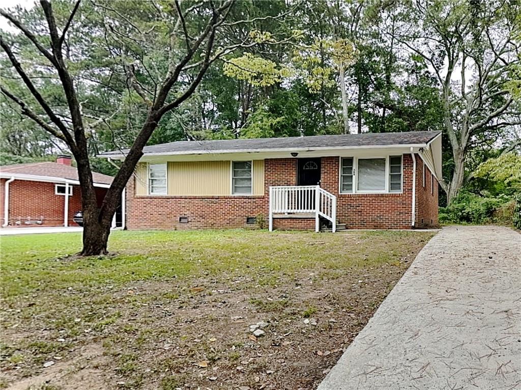 a front view of house with yard and green space