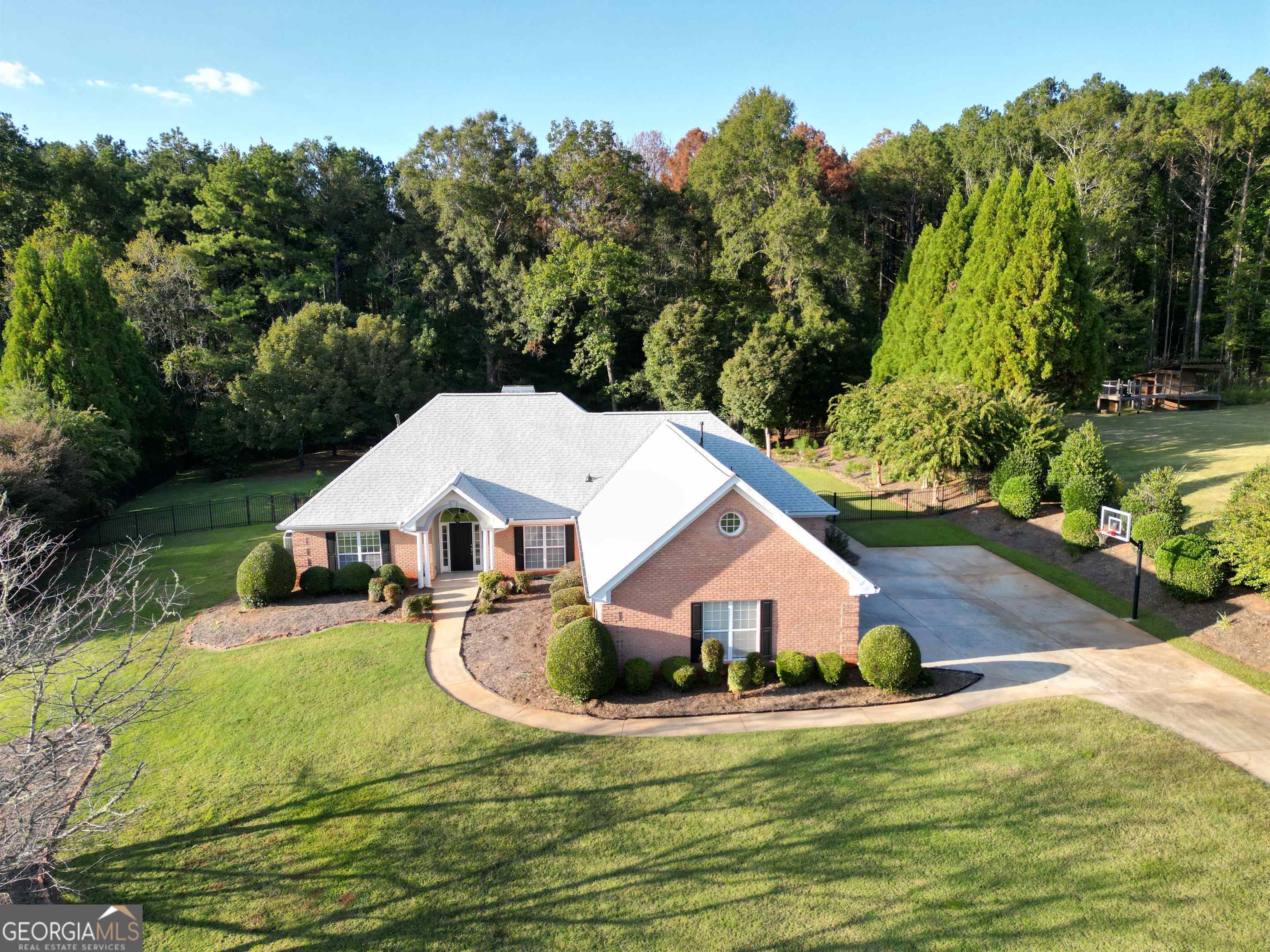 a view of house that has a yard