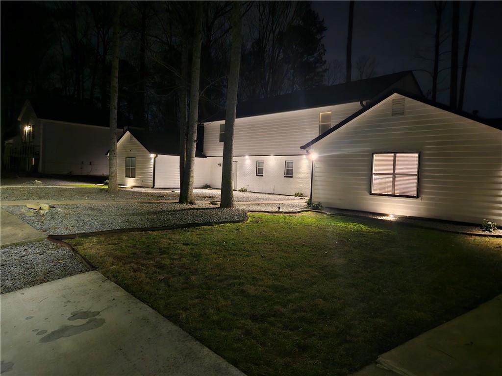 a front view of a house with garden