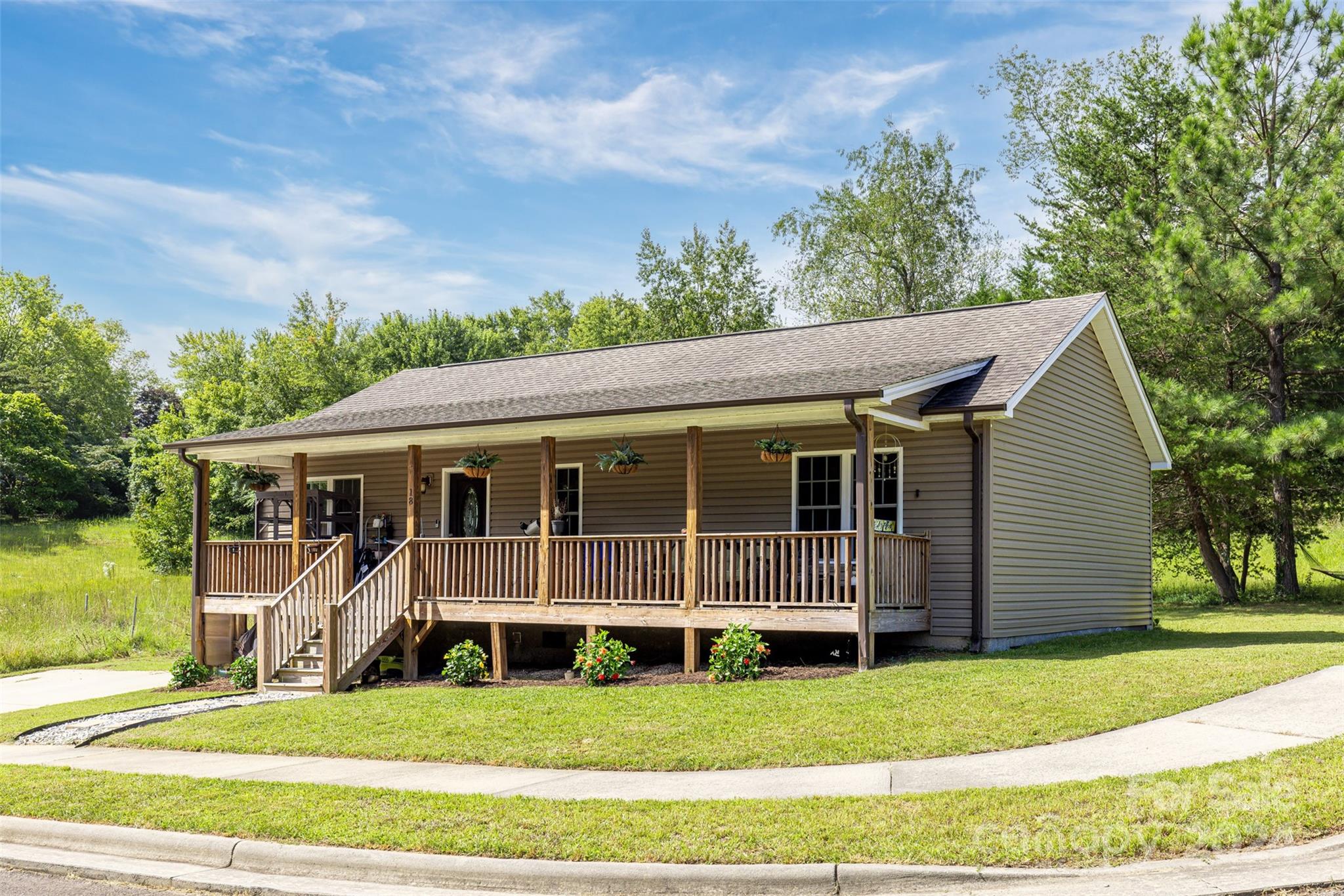 a view of a house with a yard from a patio