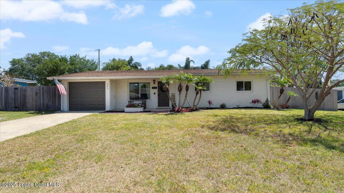 front view of a house with a yard