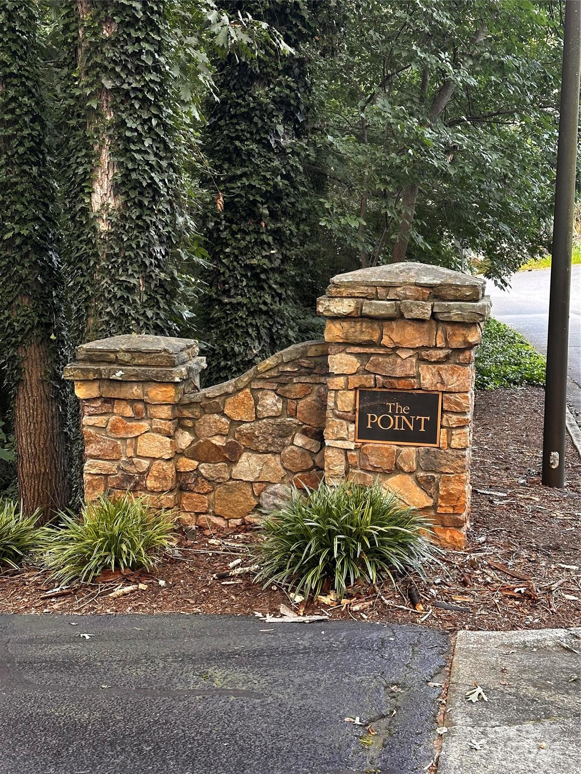 a pathway of a house with a yard