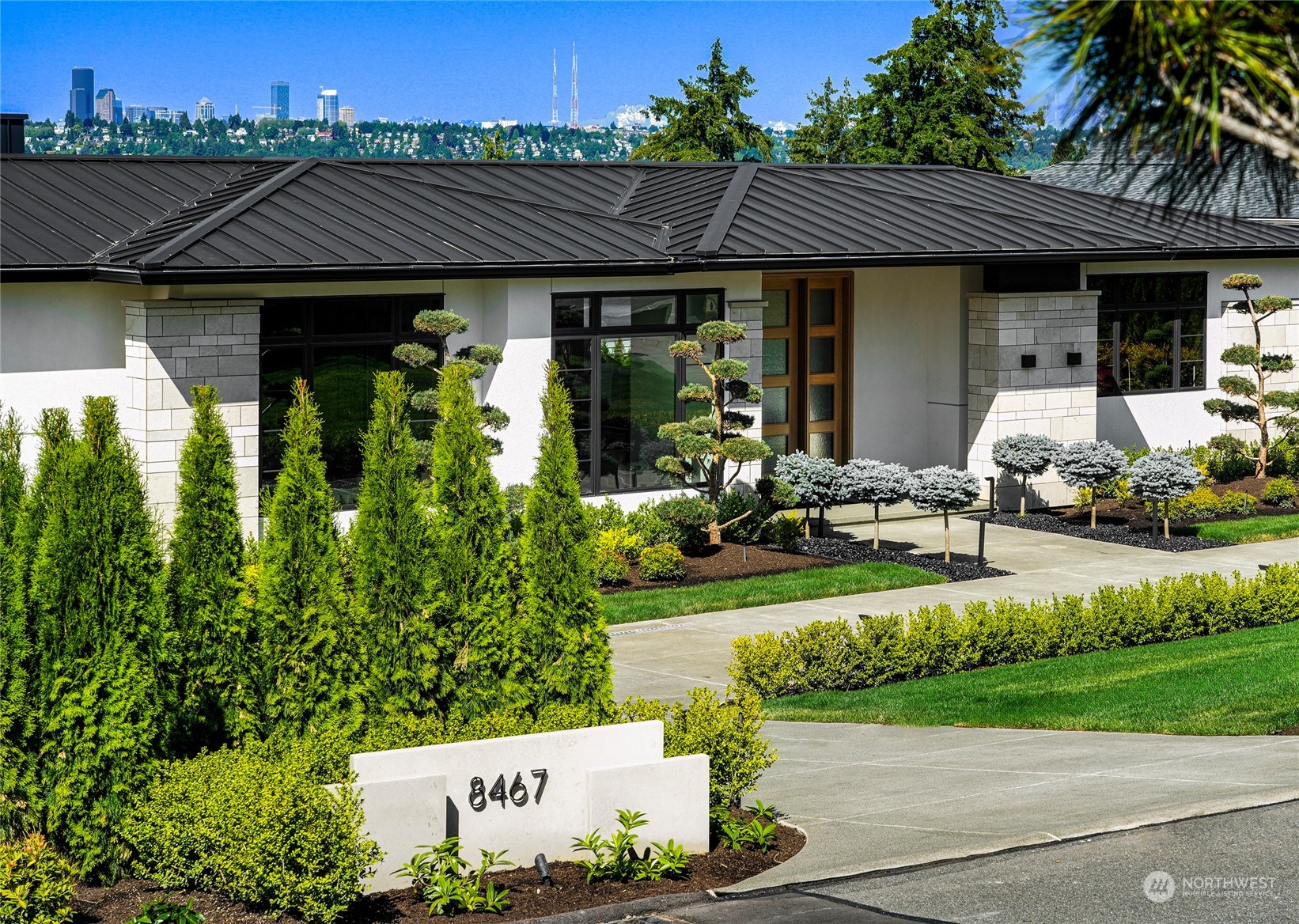 a front view of a house with garden