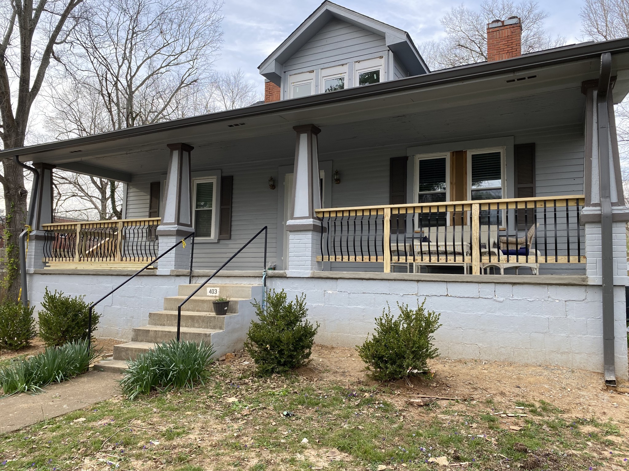 a front view of a house with a porch