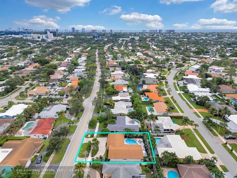 an aerial view of residential houses with outdoor space