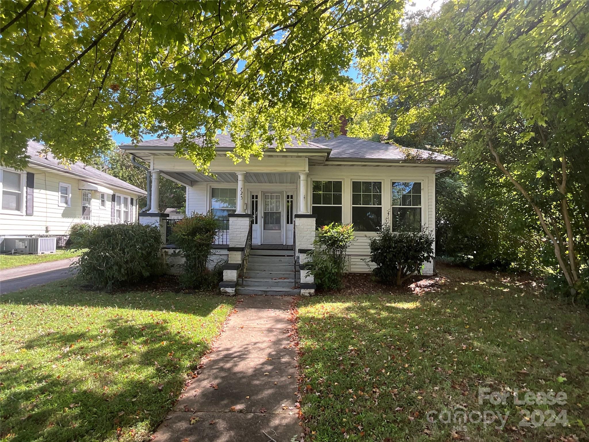 a view of a house with a yard porch and sitting area