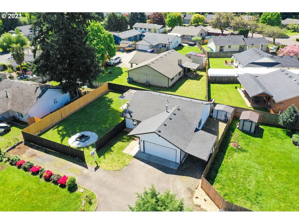 an aerial view of a pool patio yard and mountain view