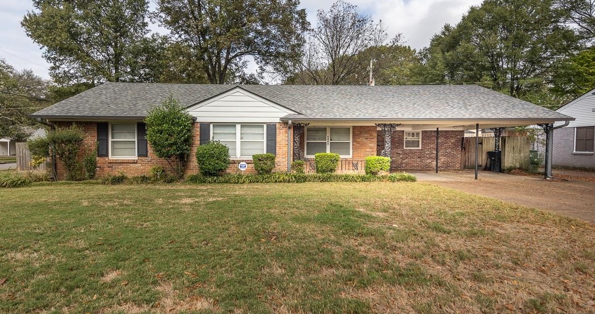 front view of a house with a yard