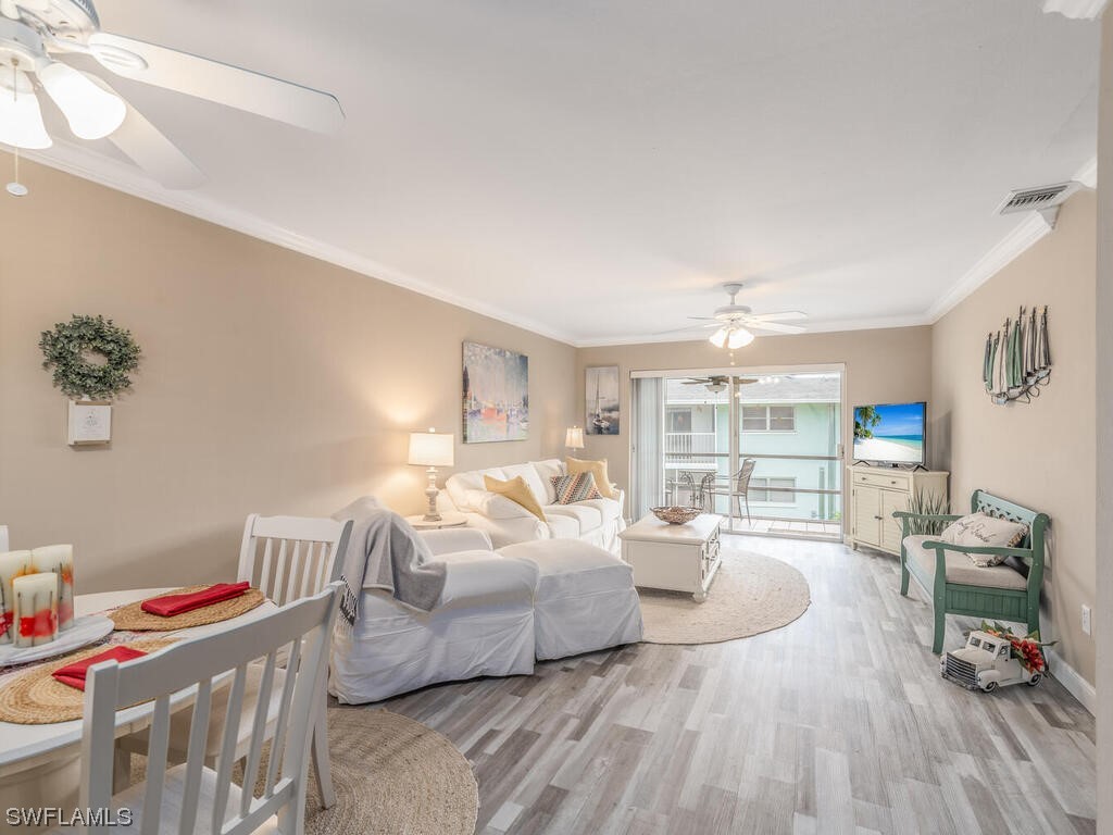 a bedroom with furniture and a wooden floor