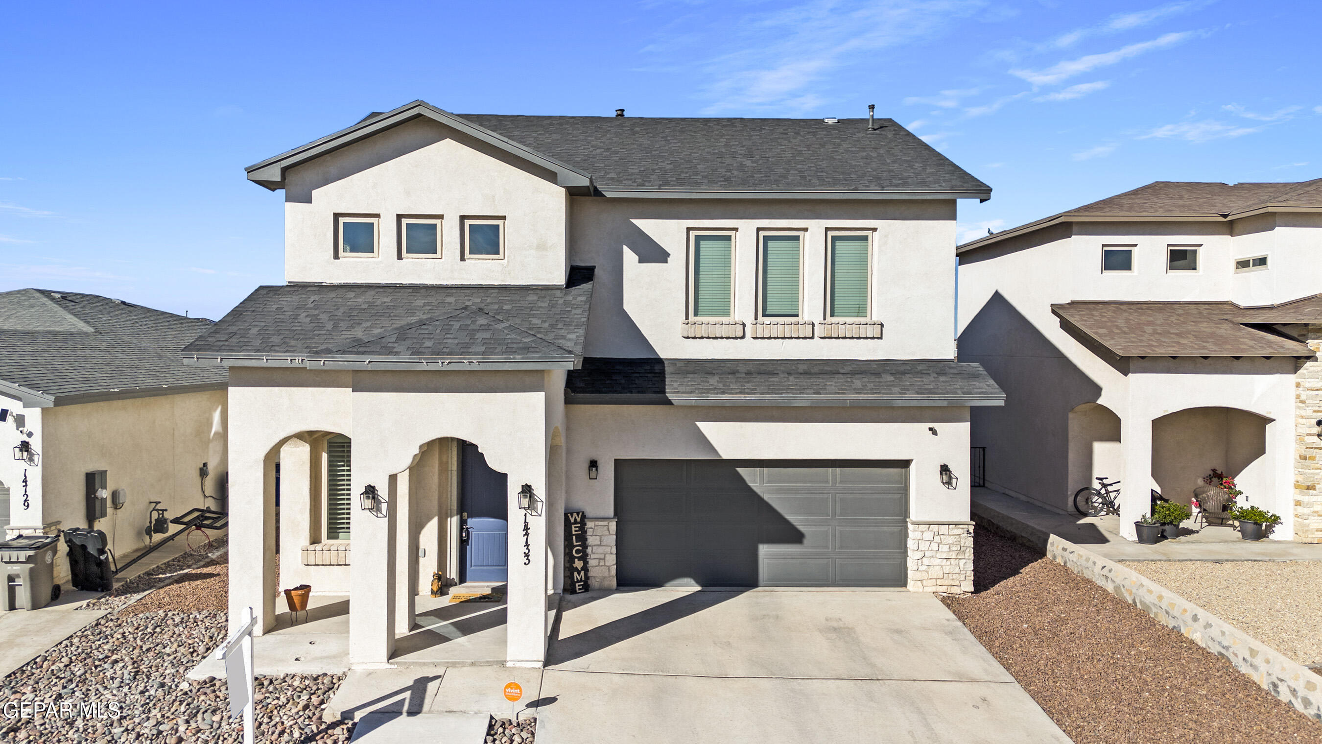 a front view of a house with yard