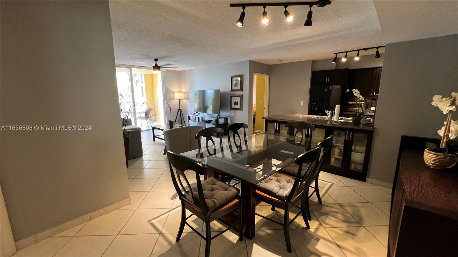 a dining room with furniture and window