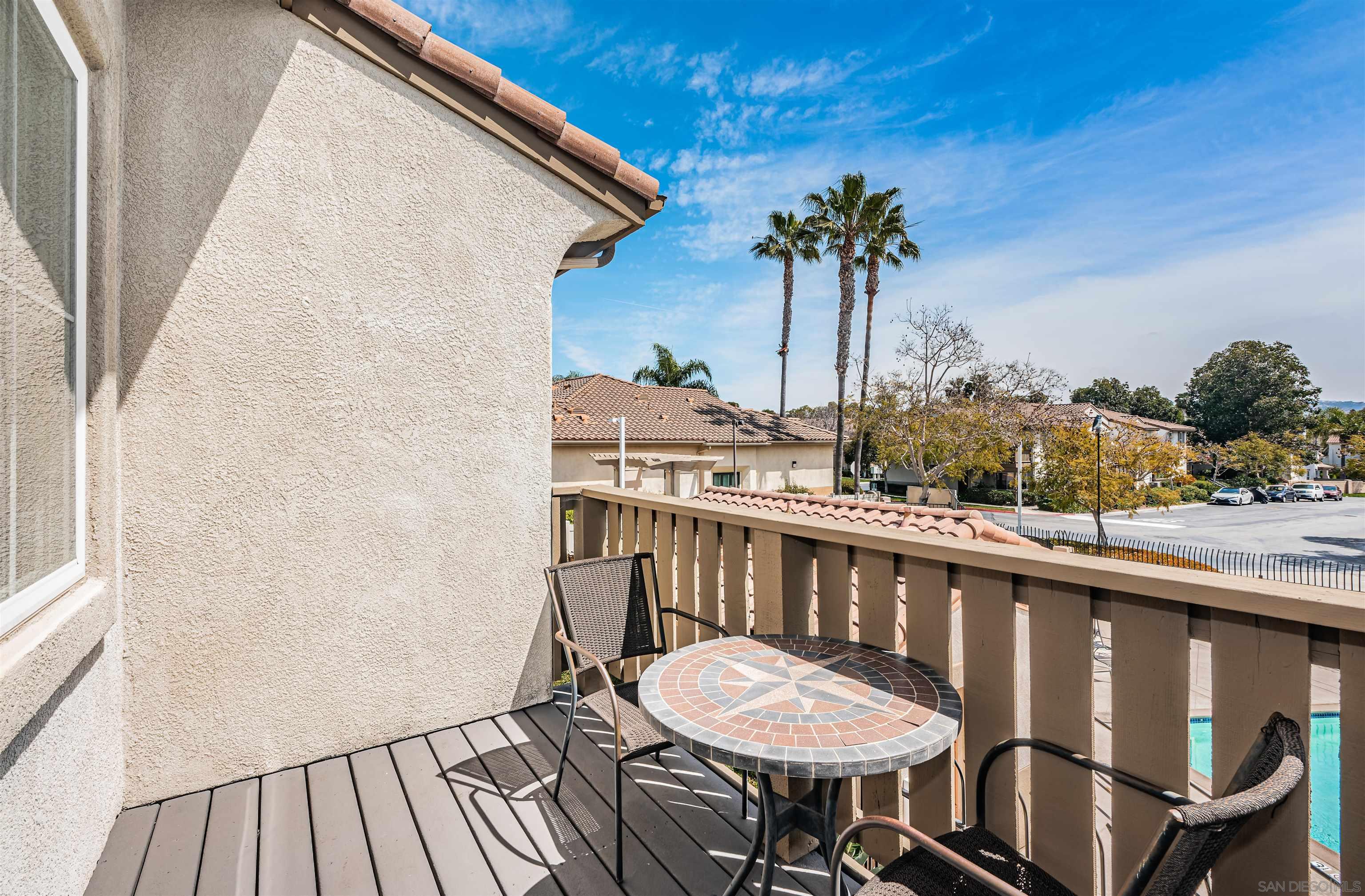 a view of a balcony with furniture