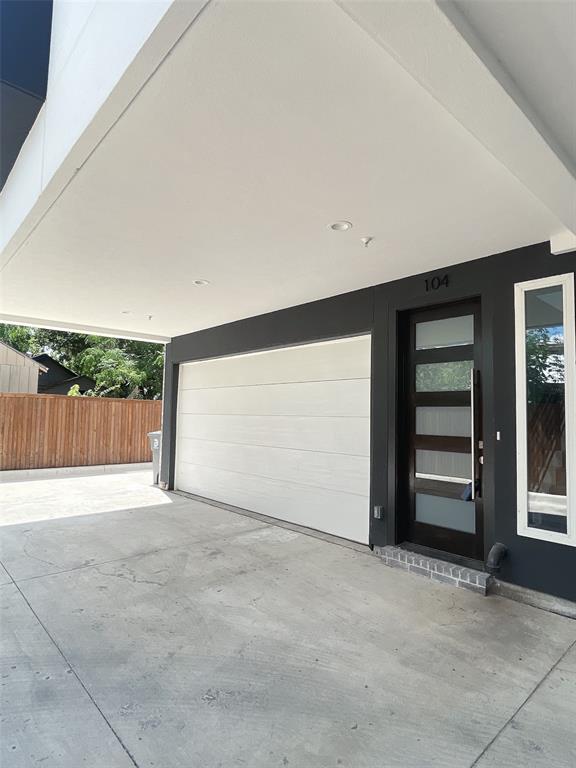 an empty room with an empty space and garage