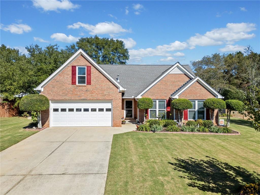 a view of large house with a yard