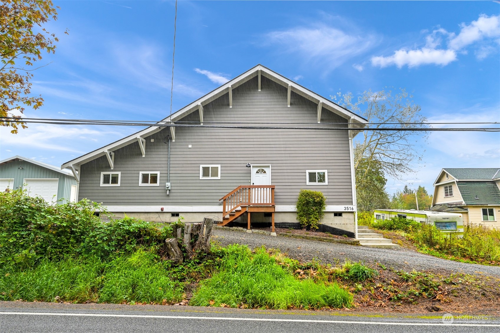 a front view of a house with a yard