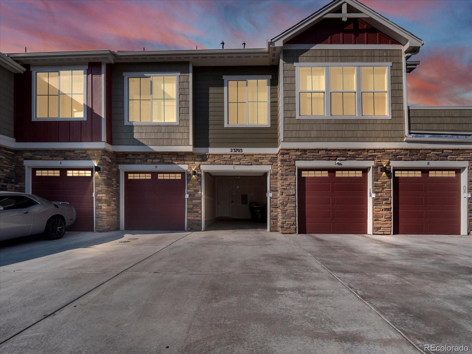 a front view of a house with a garage