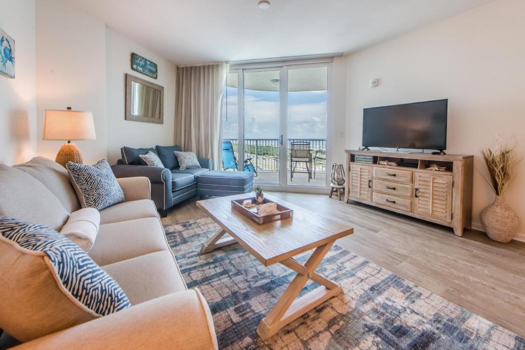 a living room with furniture and a flat screen tv