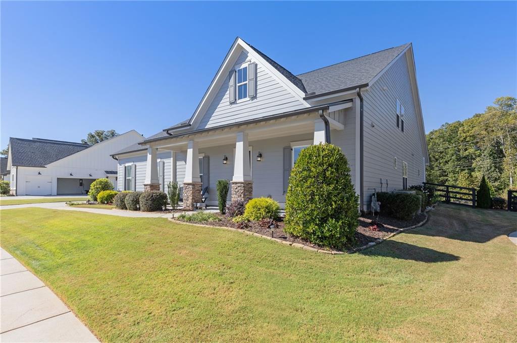 a front view of a house with a yard