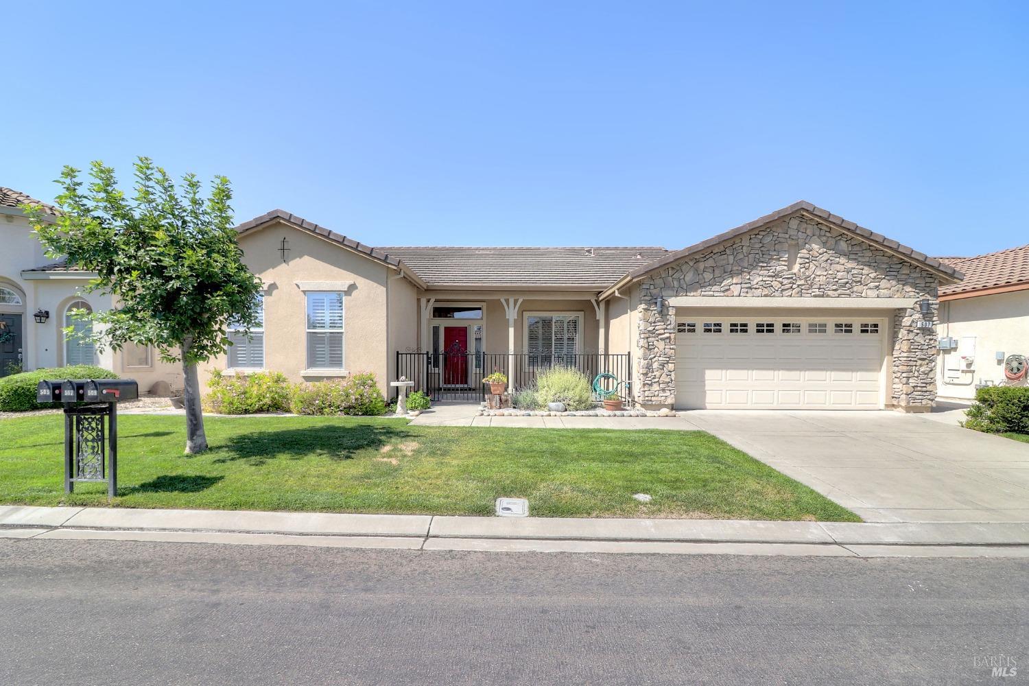 a front view of a house with a yard