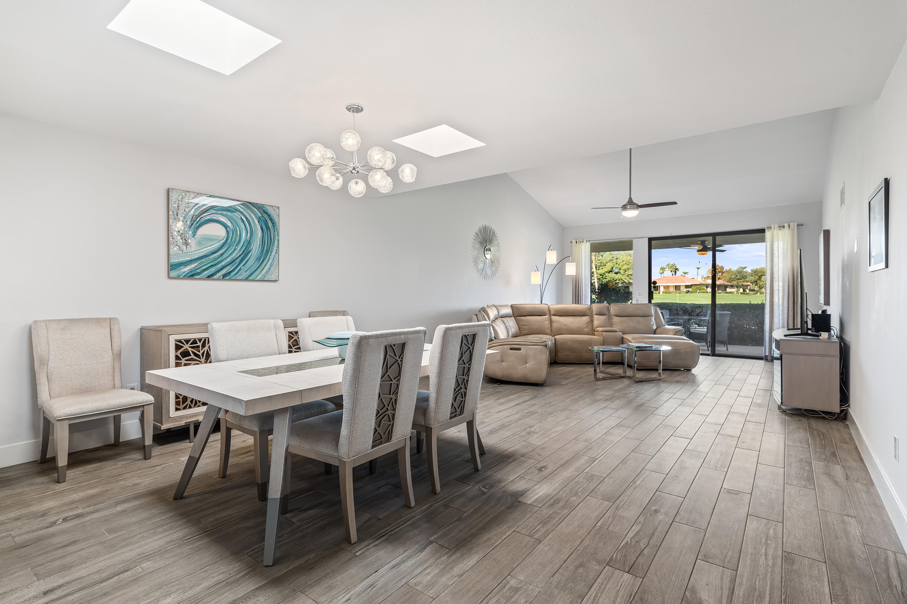 a view of a dining room with furniture window and wooden floor