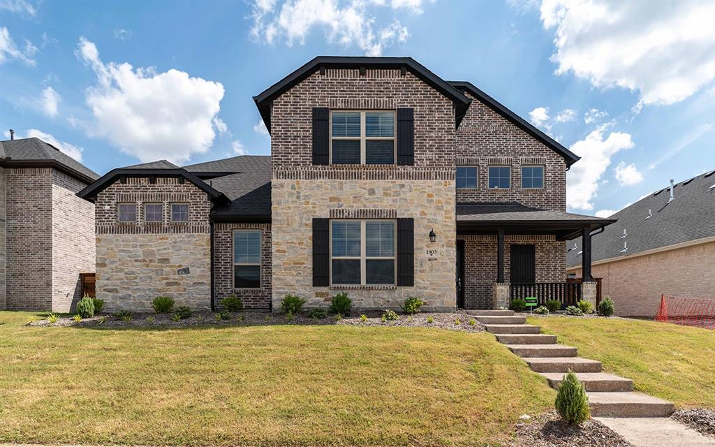 a front view of a house with yard