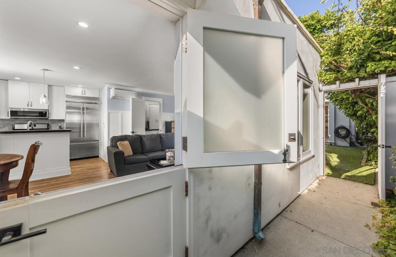 a kitchen with stainless steel appliances granite countertop a sink and a refrigerator