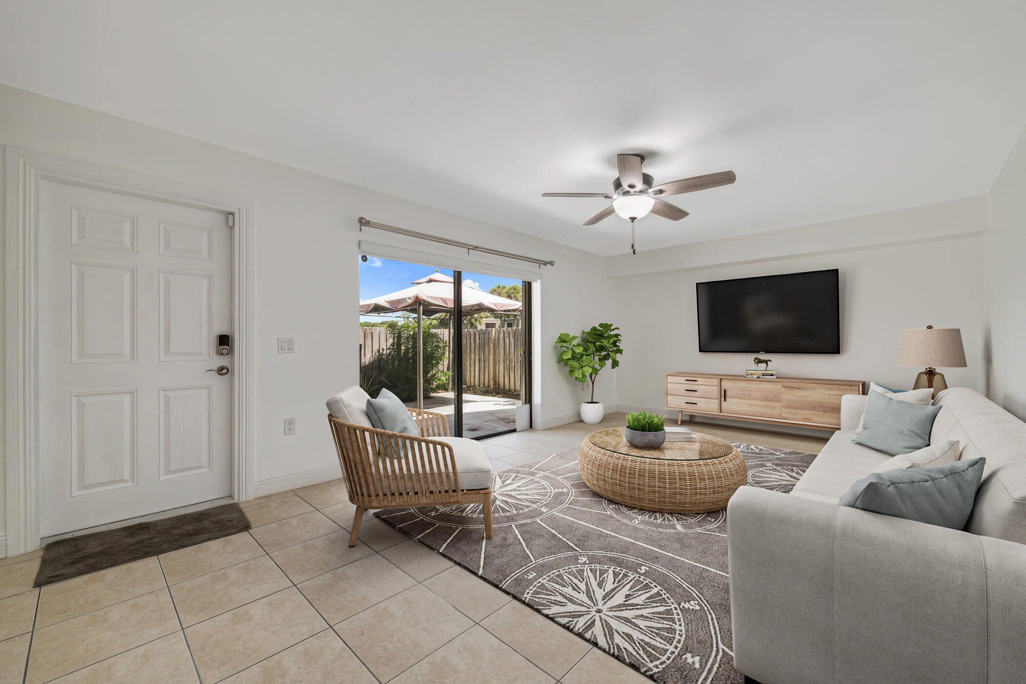 a living room with furniture and a flat screen tv