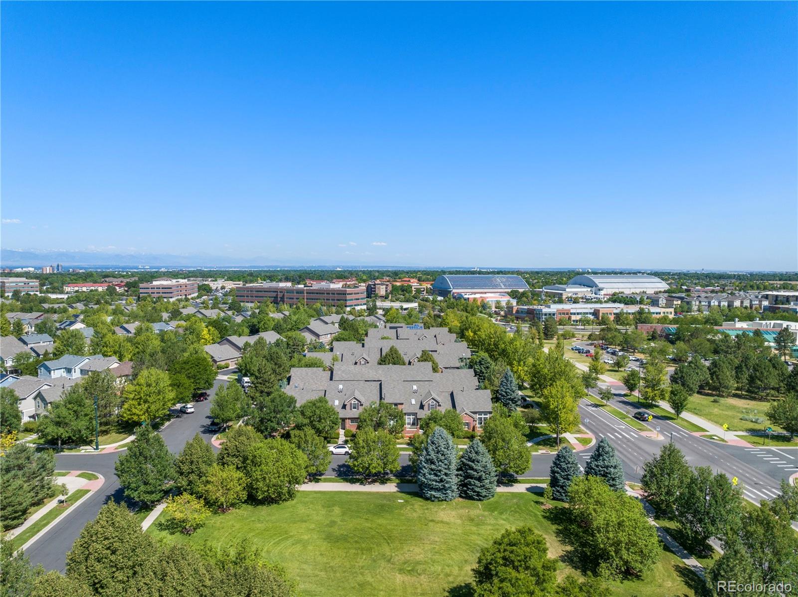 an aerial view of multiple house with yard