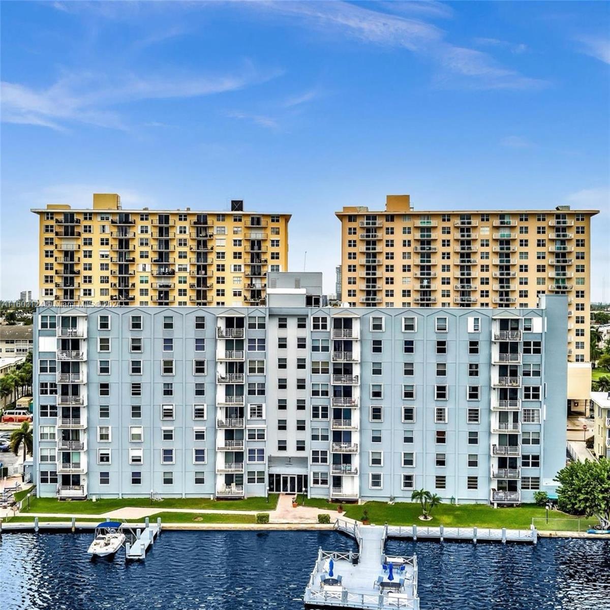 a view of building with a swimming pool and outdoor space